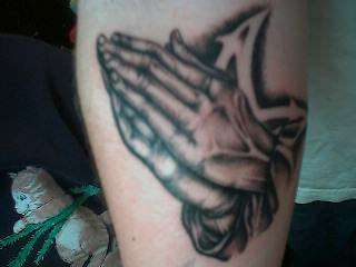 Praying hands tattoo