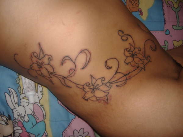 torso flower vine tattoo