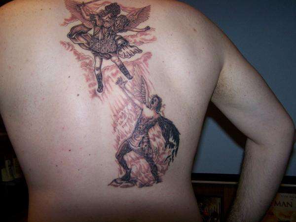 Back tattoo...Michael defeats the devil tattoo