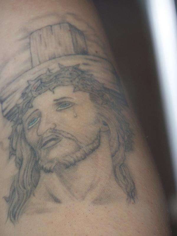 Jesus in black and grey work tattoo