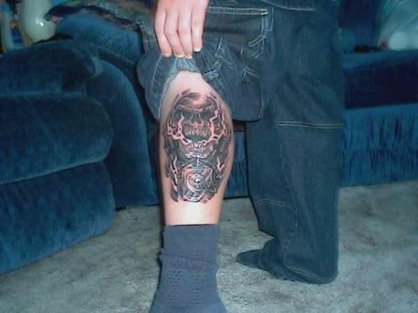 Skull and engine tattoo