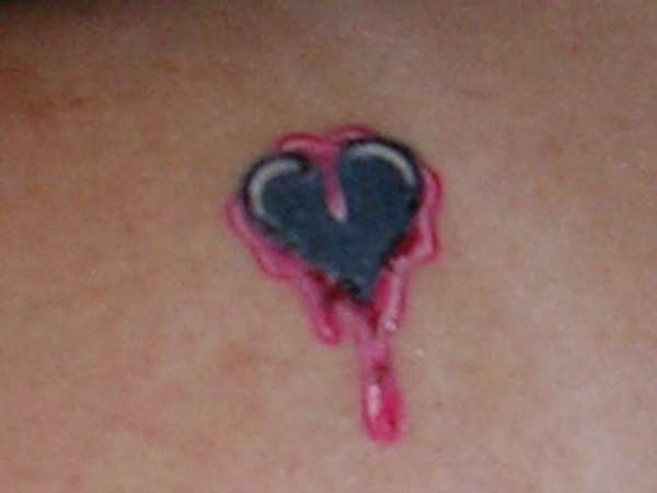 bleeding black heart tattoo