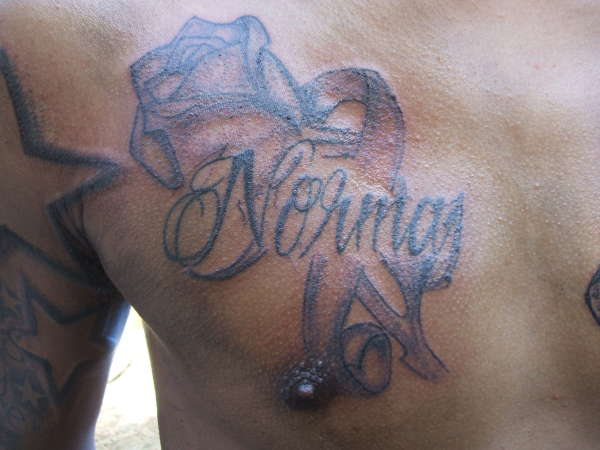 mothers name w/ a rose tattoo