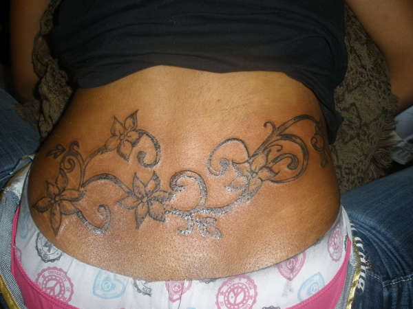 vines of lil flowers tattoo