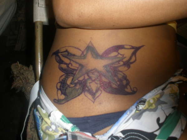 COVER UP OF A STAR TURN TO A SAR BUTTERFLIY tattoo