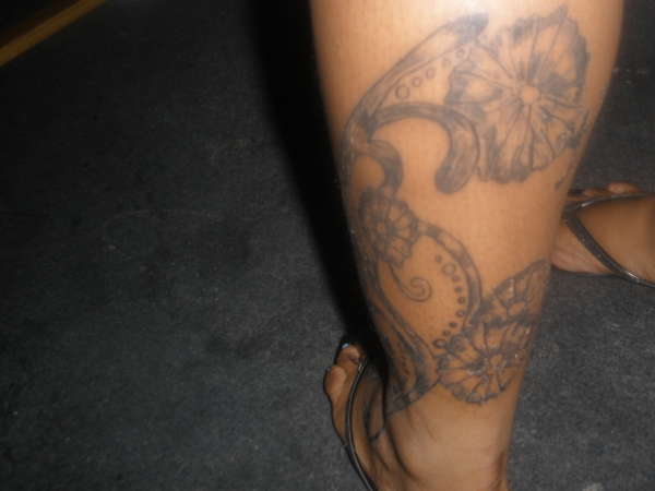 FLOWERS ON ANKLE TO FEET tattoo