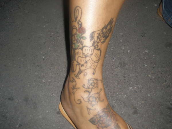 FLOWERS ON FEET N ANKLE W/ TAURUS SYMBOL tattoo