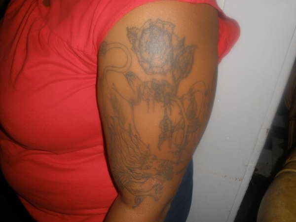 LION FOR LEOS FOR DAUGHTER N FLOWERS tattoo
