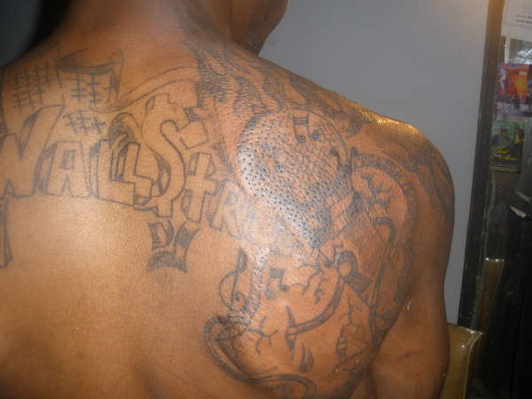 MICROPHONE WITH THE MI MITTEN WITH GROUP NAME tattoo