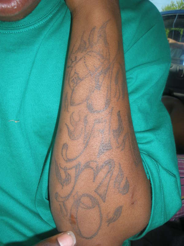 NAME WITH DETROIT HAT ON IT tattoo