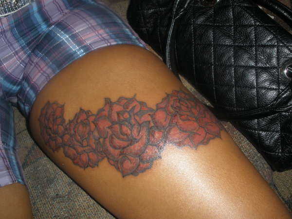 RED ROSES ON THIGH tattoo