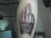 Middle finger on back of my leg tattoo
