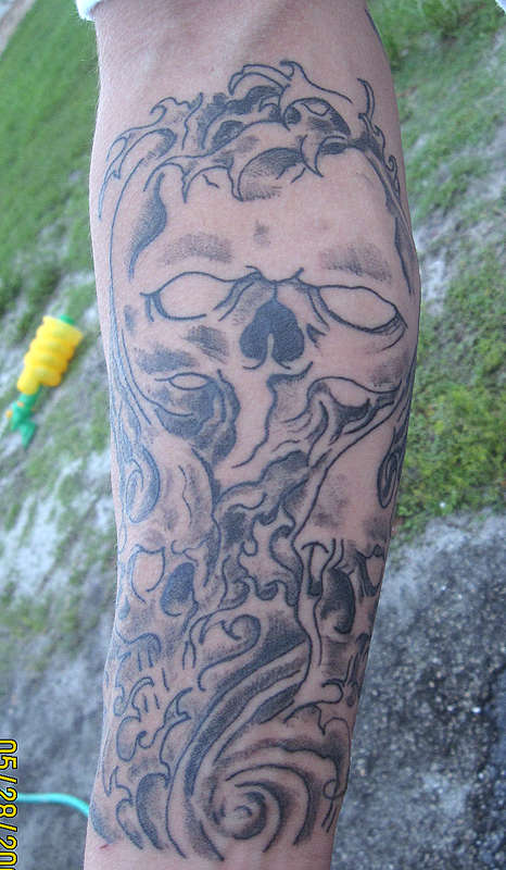 Skulls On Forearm tattoo