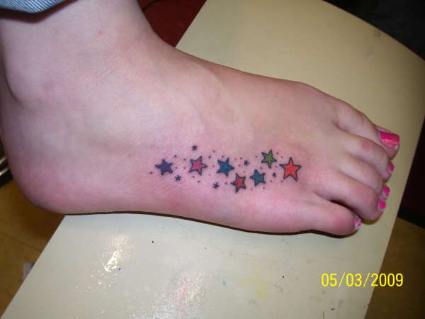 stardust on foot tattoo