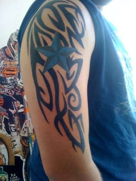custom tribal with nautical star tattoo