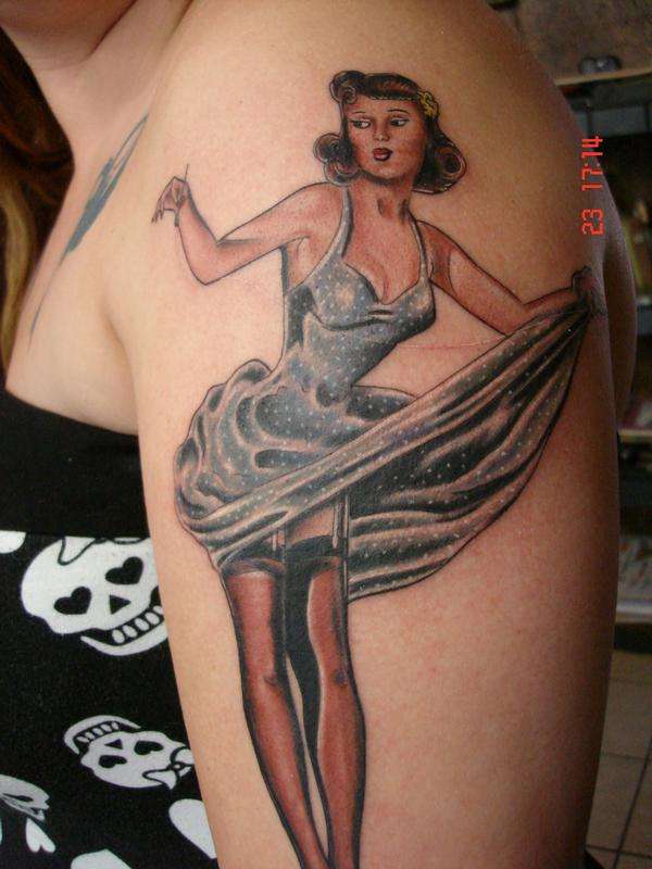 pinup sewing her dress tattoo