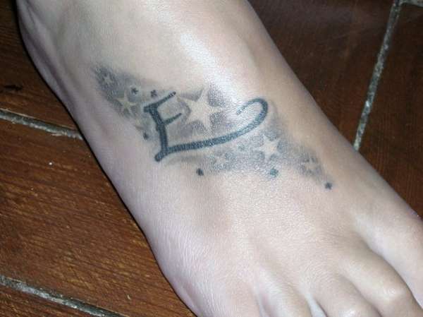 tattoo on foot, letter E + stars tattoo