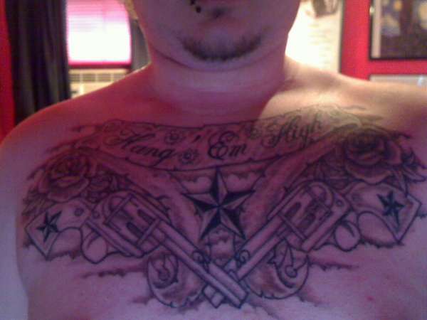 Crossed Revolvers Chest Piece tattoo