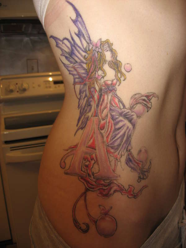 Fairy sitting on the Letter "A" tattoo