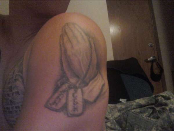 praying hands with dog tags tattoo