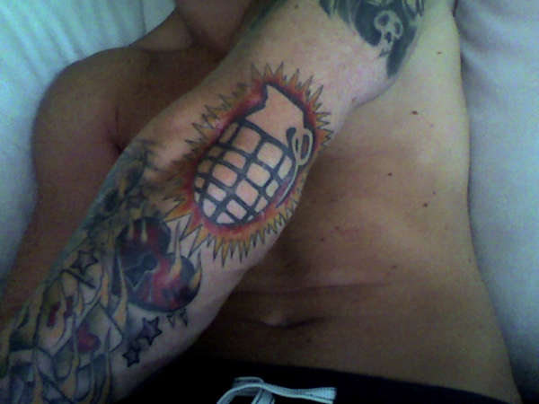 Grenade (negative space) tattoo
