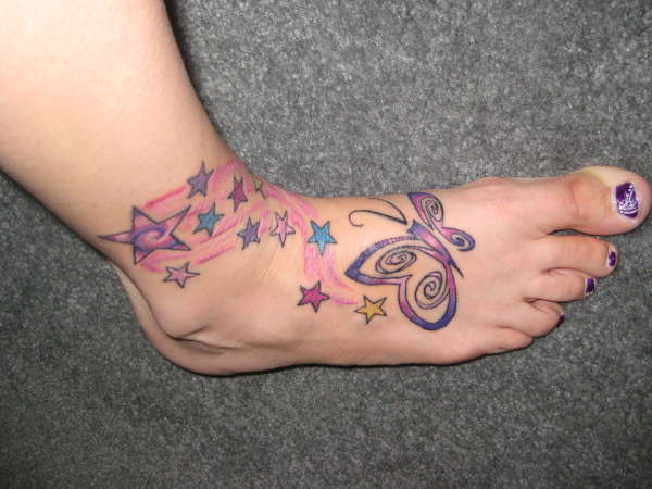 butterfly and shooting stars on foot and ankle tattoo