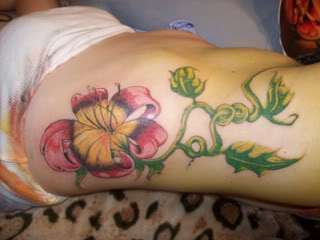 Flower on side tattoo