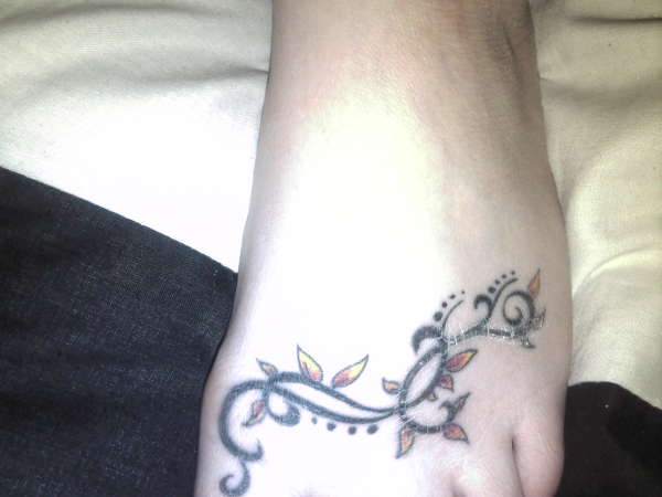 Foot vine tattoo