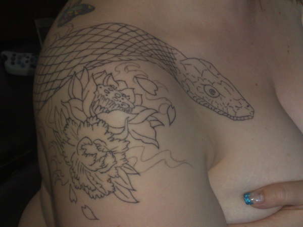 snake/back continued onto chest and shoulder tattoo
