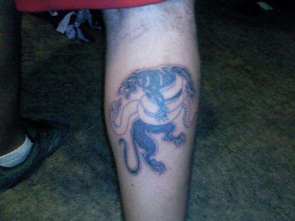 Panther fighting snake tattoo