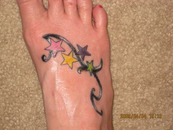 Stars on foot tattoo