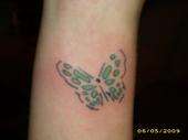 ~ butterfly on right wrist tattoo