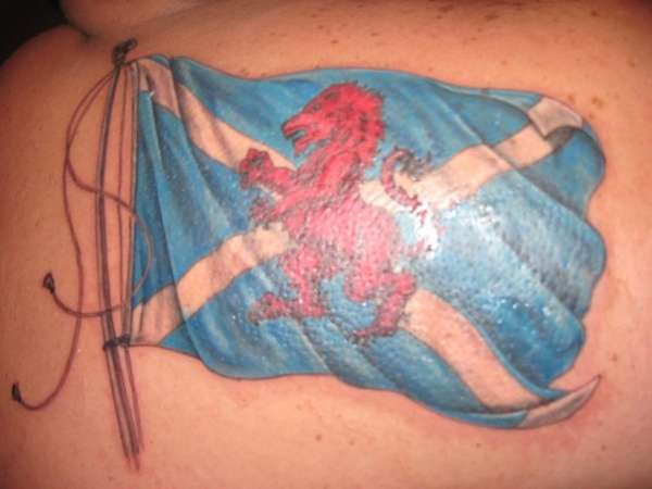 Rampant lion in St Andrews flag tattoo
