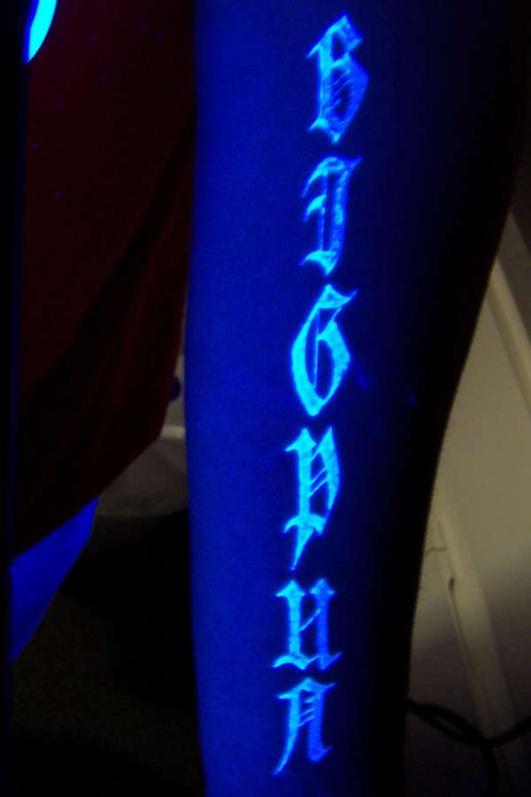 blacklight lettering tattoo