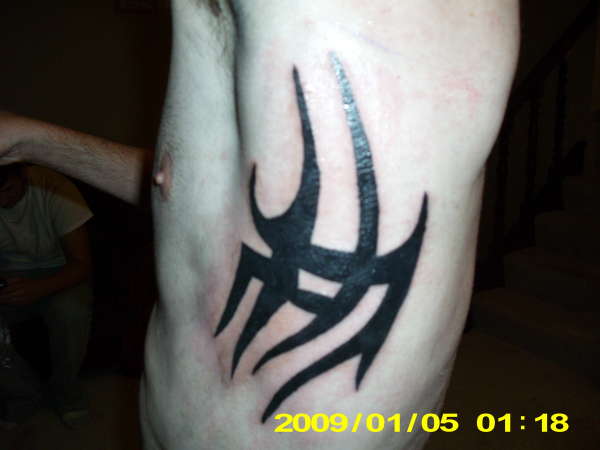 this is on my buddy its an identicle tat from his other side tattoo