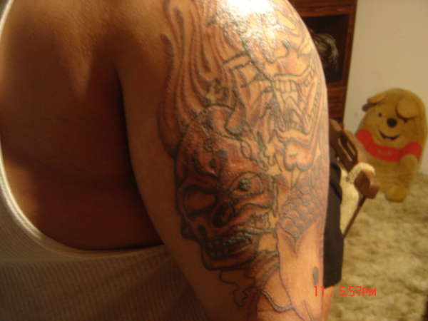 Skulls co fish cover up tattoo