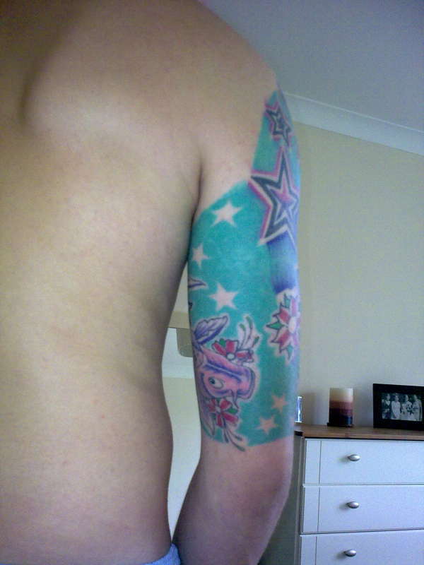 star and koi half sleeve tattoo