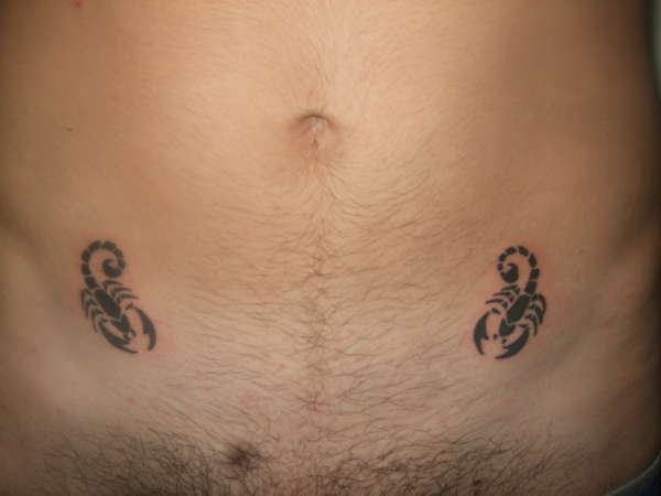 2x Scorpions on Stomach tattoo