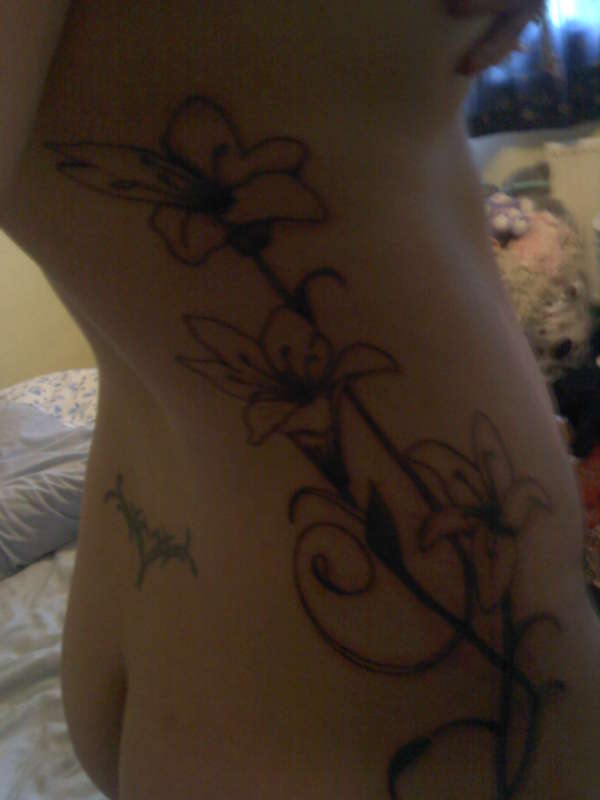 lillys on my ribs and side tattoo