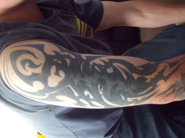 tribal cover up white over black ink tattoo