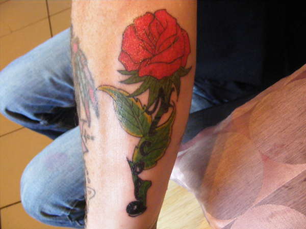 wifes name on rose tattoo
