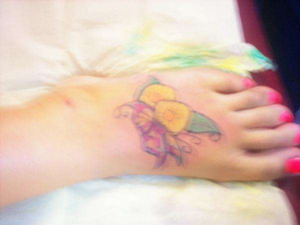Two flowers & butterfly tattoo