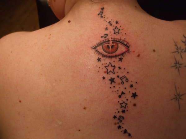 Eye, stars & music notes tattoo