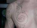 chest tribal/outline tattoo