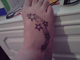 stars on wifes foot tattoo