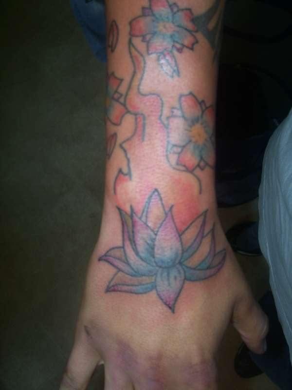 lotus and cherry blossoms tattoo
