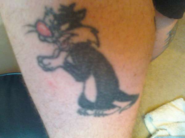 Sylvester, left leg. tattoo