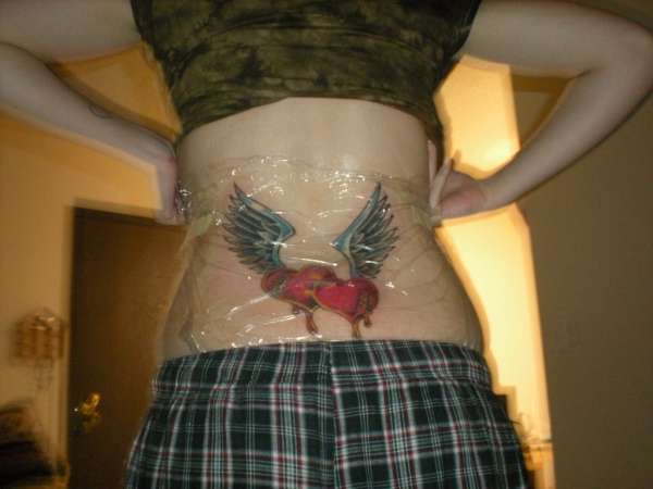 Two Broken Hearts Mending tattoo