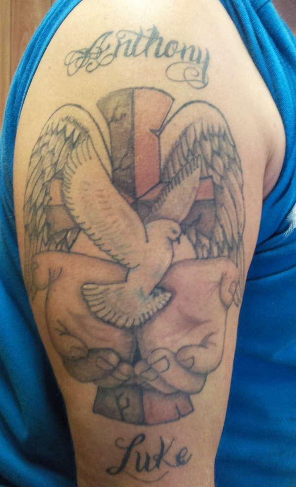 cross with dove tattoo