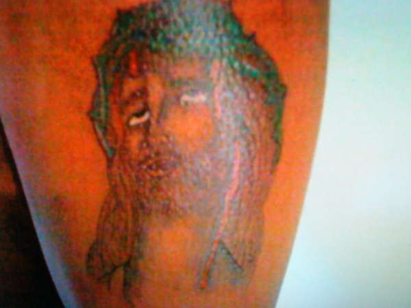 Kwame's Jesus piece tattoo